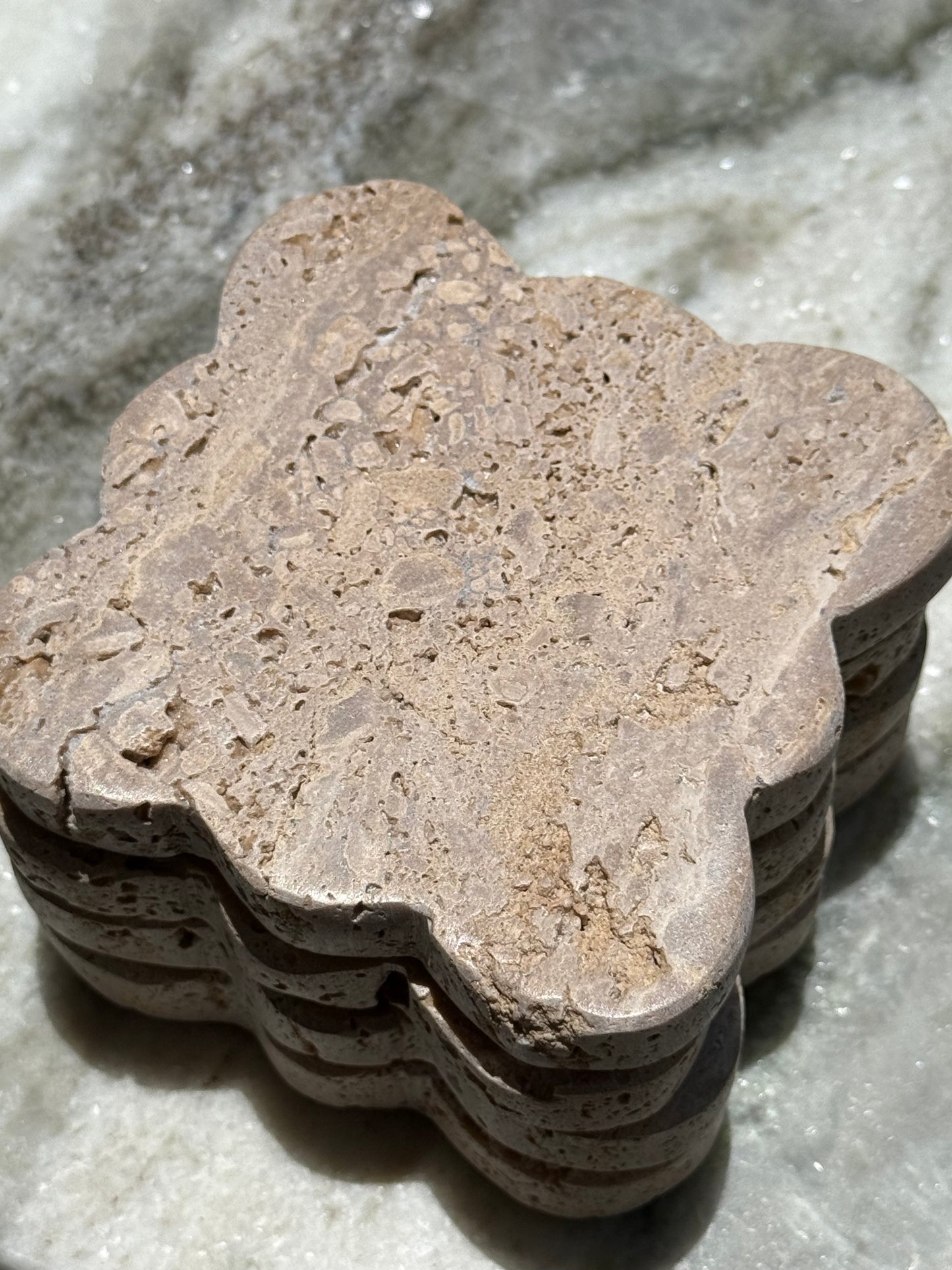 Set of four, bold yet timeless with natural stone texture and sculptural edges.